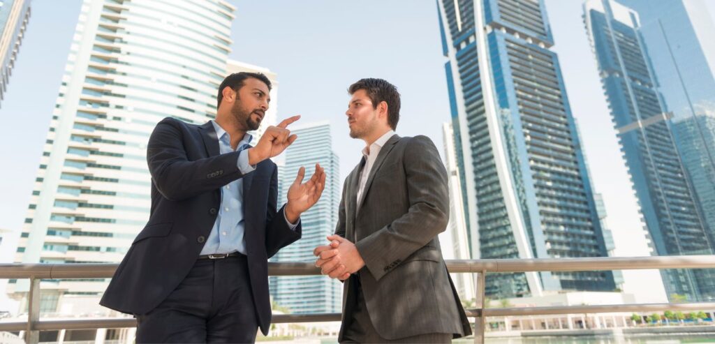 Businessmen in Dubai talking on how to set up a company